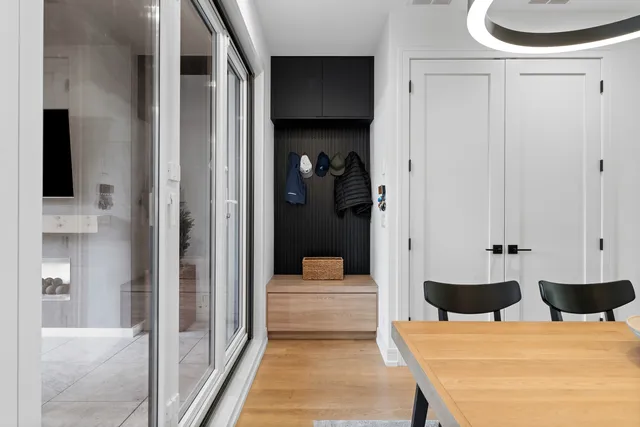 a bedroom with a bed and a view of living room