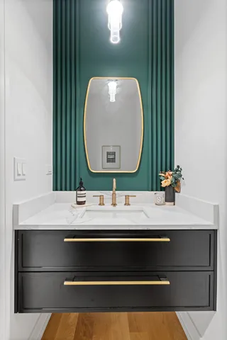 a bathroom with a sink and a mirror