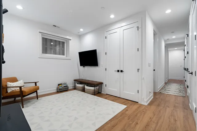 a view of a livingroom with furniture and a flat screen tv
