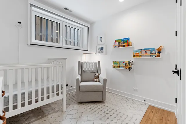 a bedroom with furniture and a window