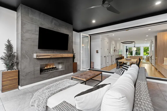 a bedroom with furniture and a flat screen tv