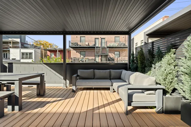 a outdoor living space with furniture and a wooden floor