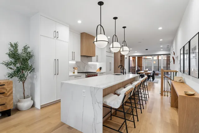 a dining room with furniture and wooden floor