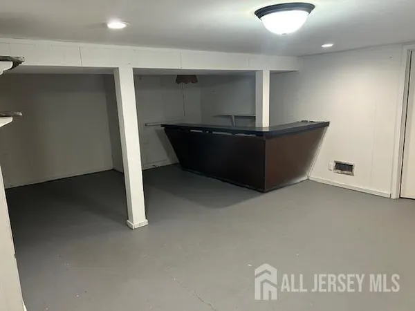 a view of a house with a deck and furniture