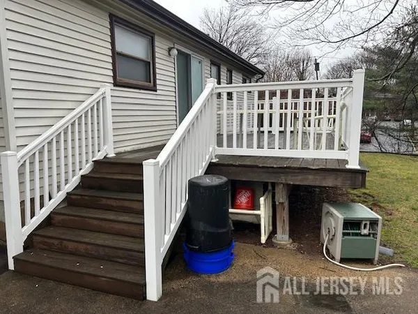 a view of a house with a yard and sitting area