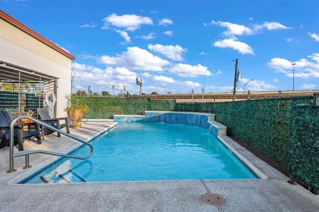 a view of a patio with swimming pool