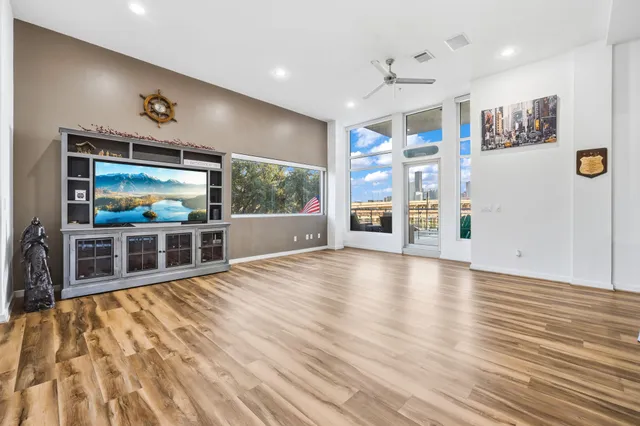a view of a livingroom with furniture and flat screen tv