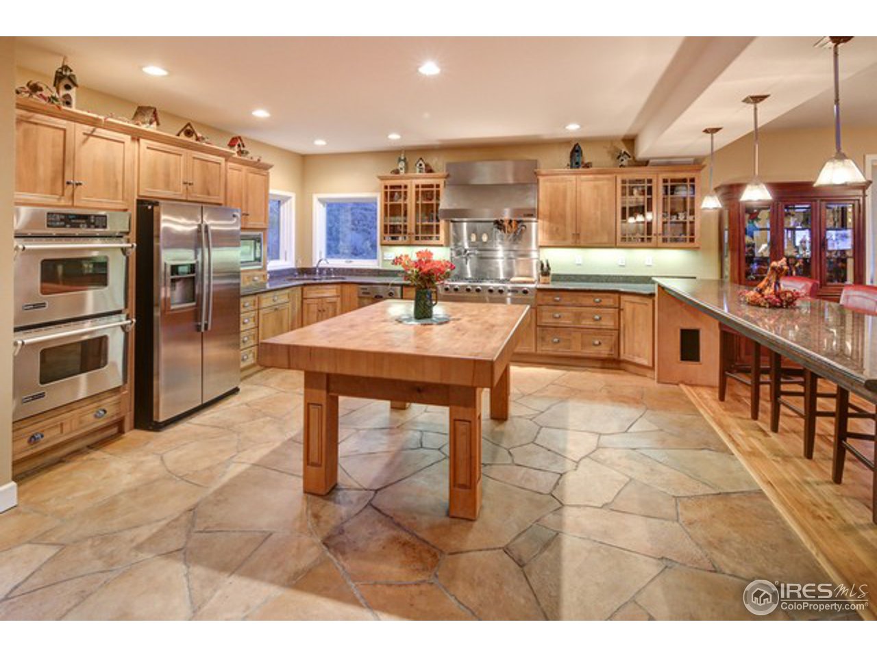 6960 Milner Mountain Ranch Road Fort Collins, CO 80526 - Photo 10 of 34 Kitchen_heated stone floor