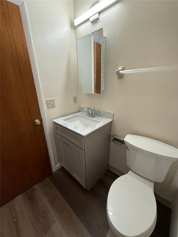 1923 Northwest 23rd Boulevard, Unit 224 Gainesville, FL 32605 - Photo 12 of 20 a bathroom with a toilet sink and mirror