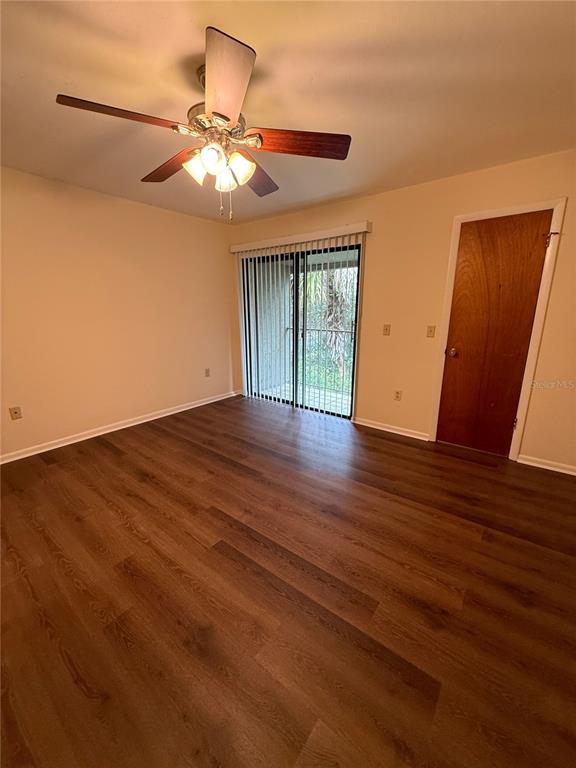 1923 Northwest 23rd Boulevard, Unit 224 Gainesville, FL 32605 - Photo 14 of 20 a view of an empty room with wooden floor and a window