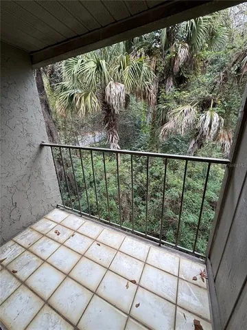 a balcony with wooden floor