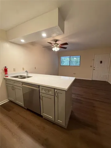 a kitchen with a sink and cabinets