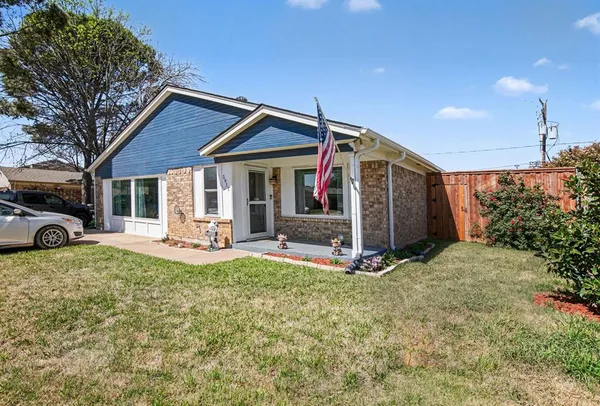 a view of a house with backyard porch and sitting area