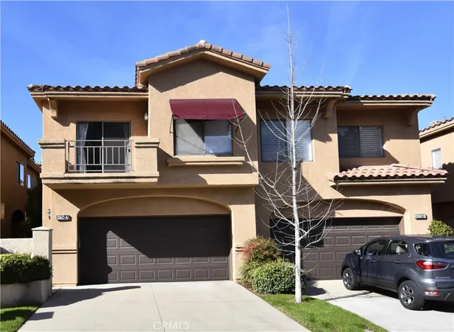 a front view of a house with a garage