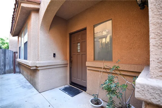 a view of a bathroom with a sink and potted plants