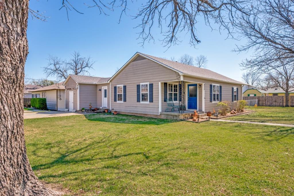 412 North 10th Street Sanger, TX 76266 - Photo 1 of 21 a view of a house with a swimming pool