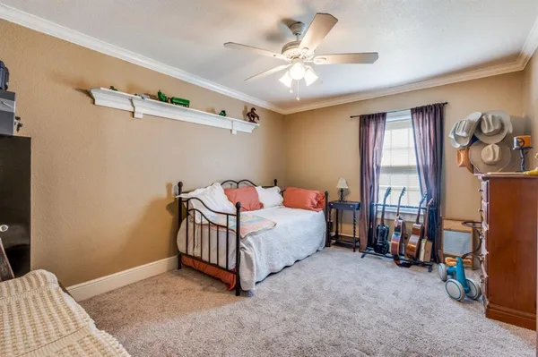 a room with a bed and a chandelier