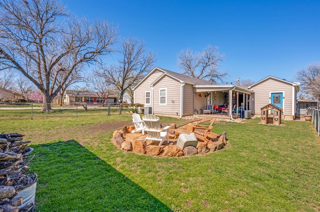 412 North 10th Street Sanger, TX 76266 - Photo 19 of 21 a front view of a house with a yard