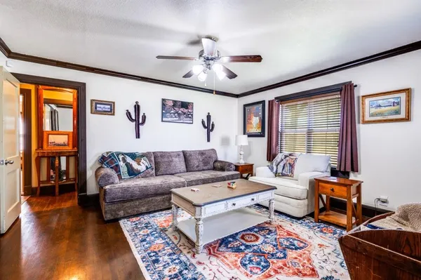 a living room with furniture and a window