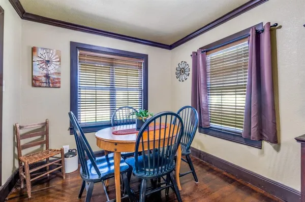 a view of a dining room with furniture and window
