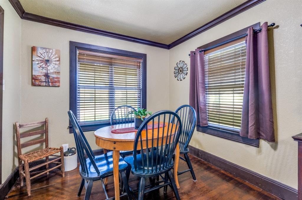 412 North 10th Street Sanger, TX 76266 - Photo 9 of 21 a view of a dining room with furniture and window