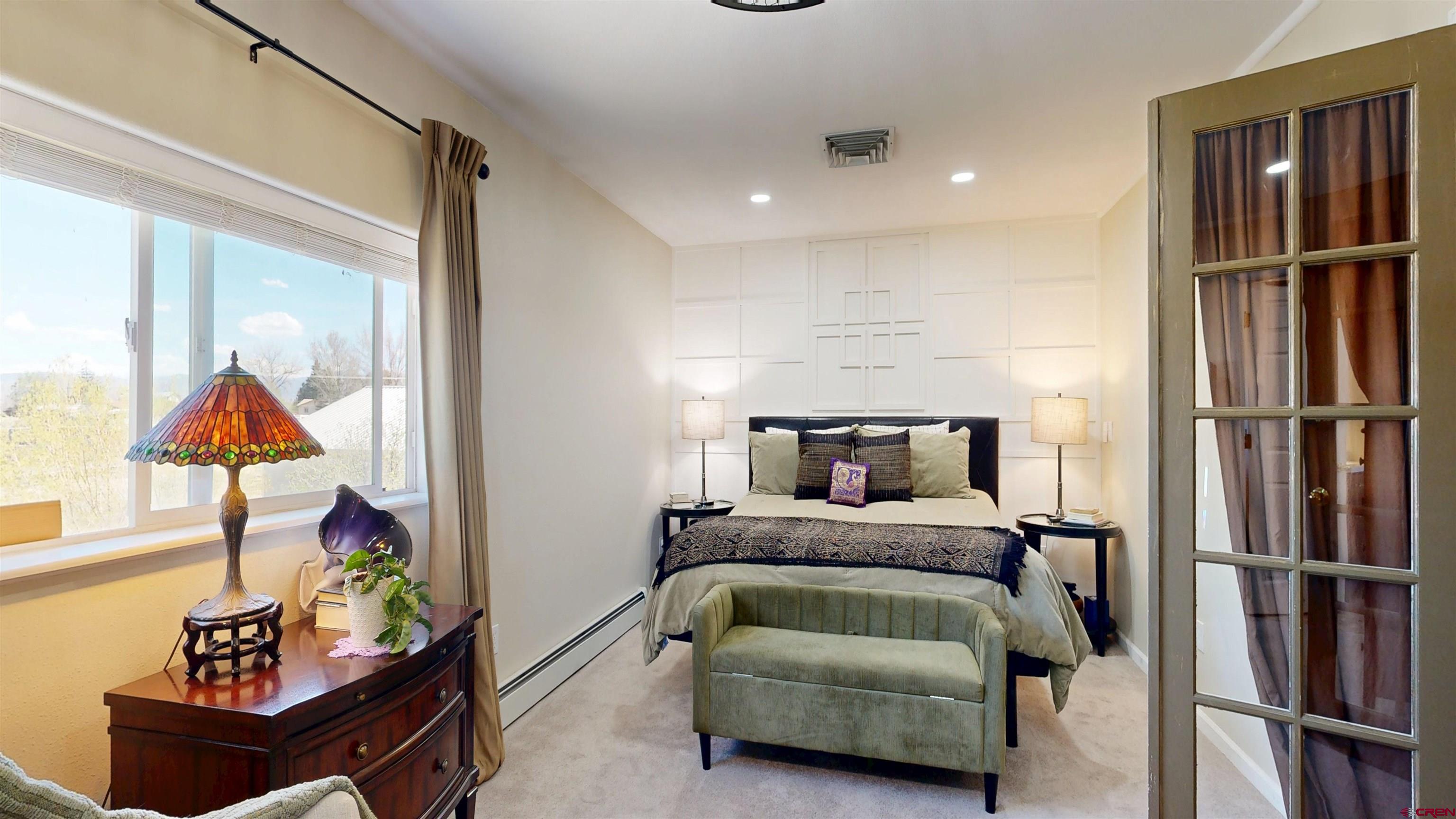 62940 Jeremy Road Montrose, CO 81401 - Photo 13 of 44 a bedroom with a bed and a window