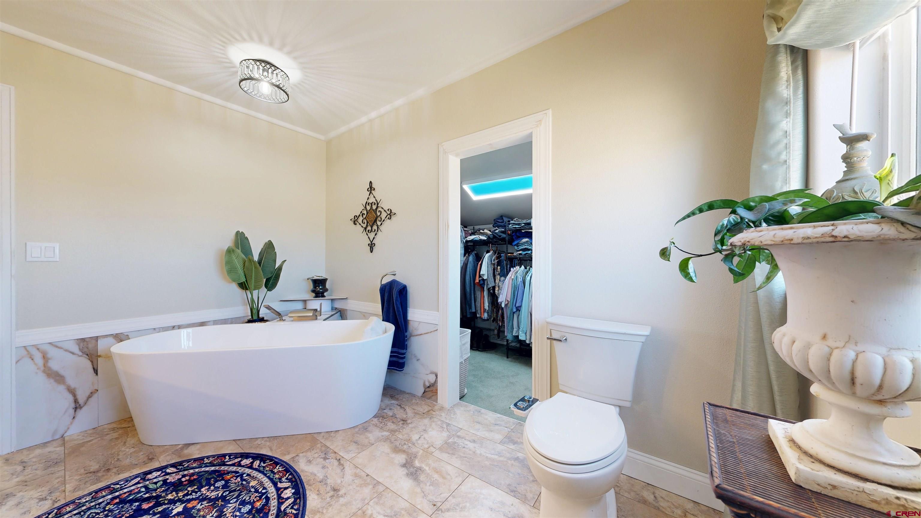62940 Jeremy Road Montrose, CO 81401 - Photo 15 of 44 a living room with furniture and a potted plant