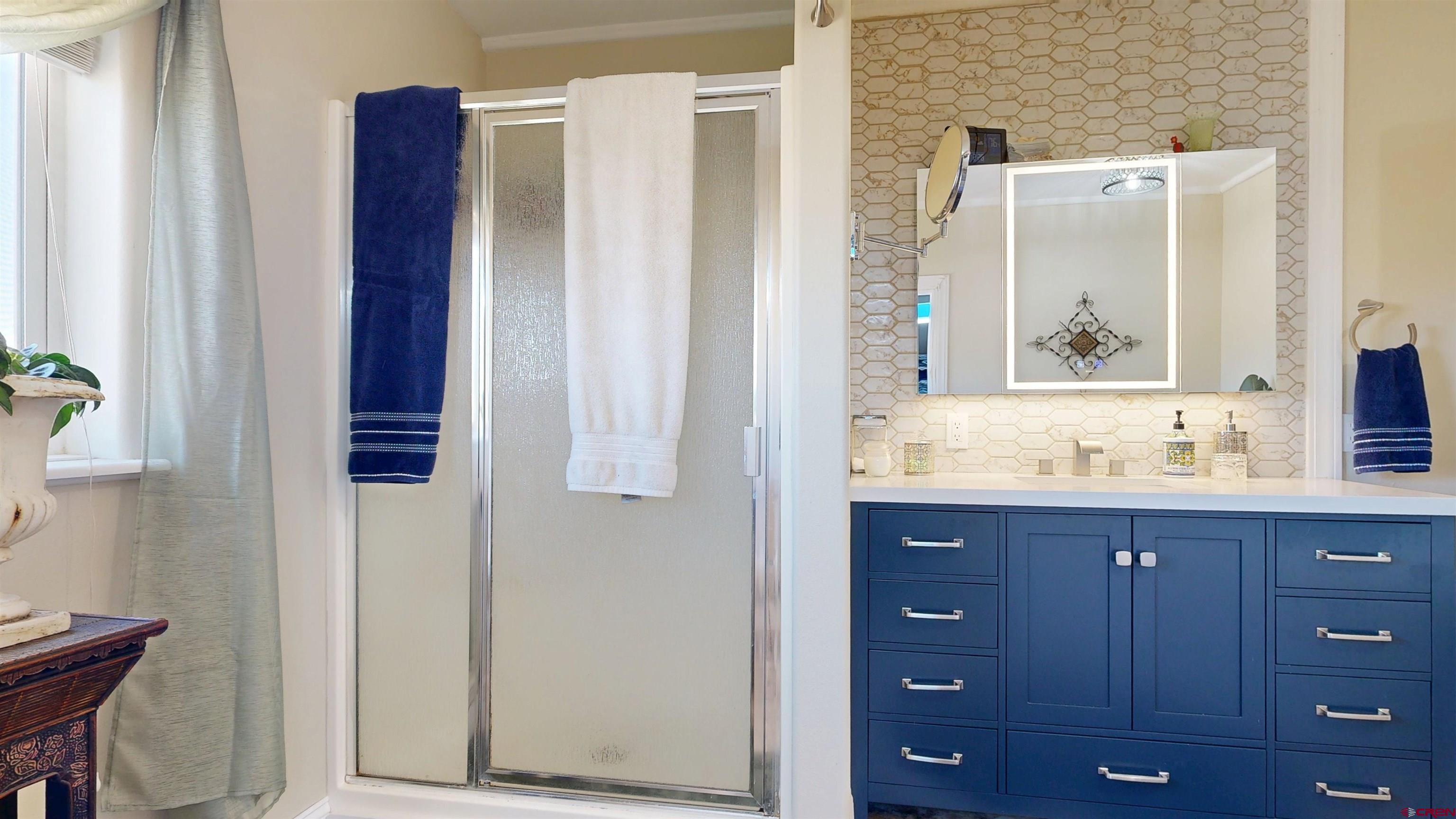62940 Jeremy Road Montrose, CO 81401 - Photo 16 of 44 a bathroom with a sink and a mirror