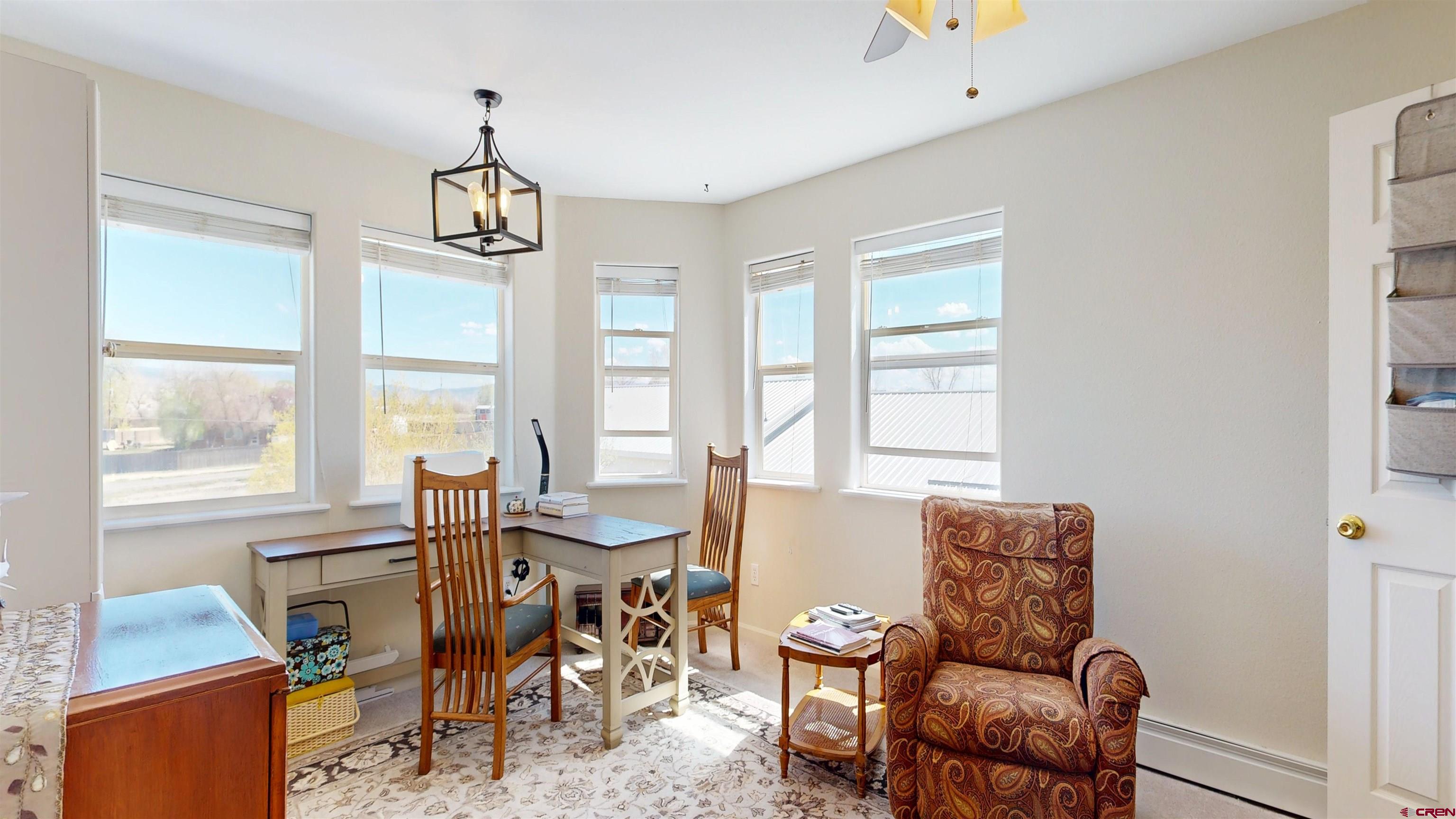 62940 Jeremy Road Montrose, CO 81401 - Photo 20 of 44 a view of a dining room with furniture window and outside view