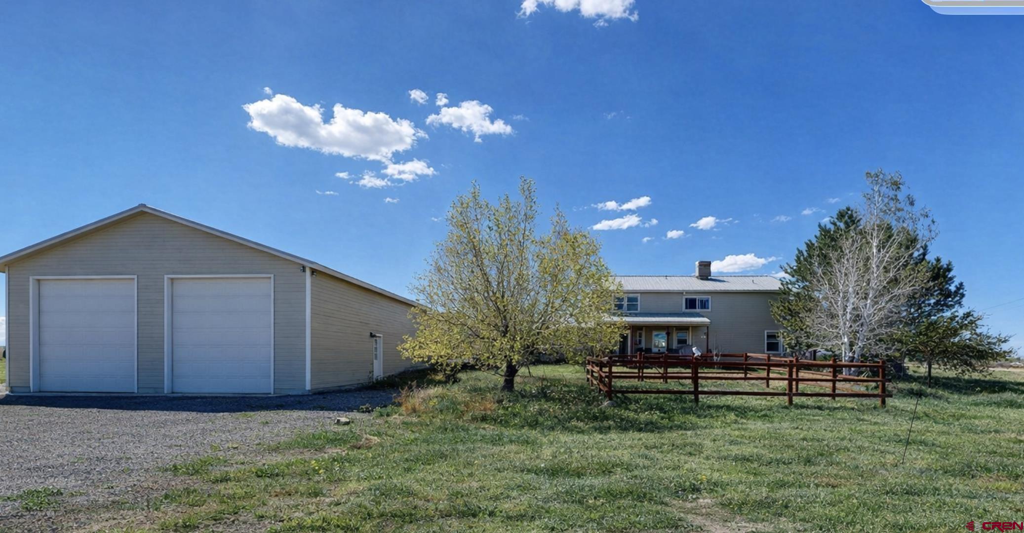 62940 Jeremy Road Montrose, CO 81401 - Photo 2 of 44 a view of a house with a backyard and a tree