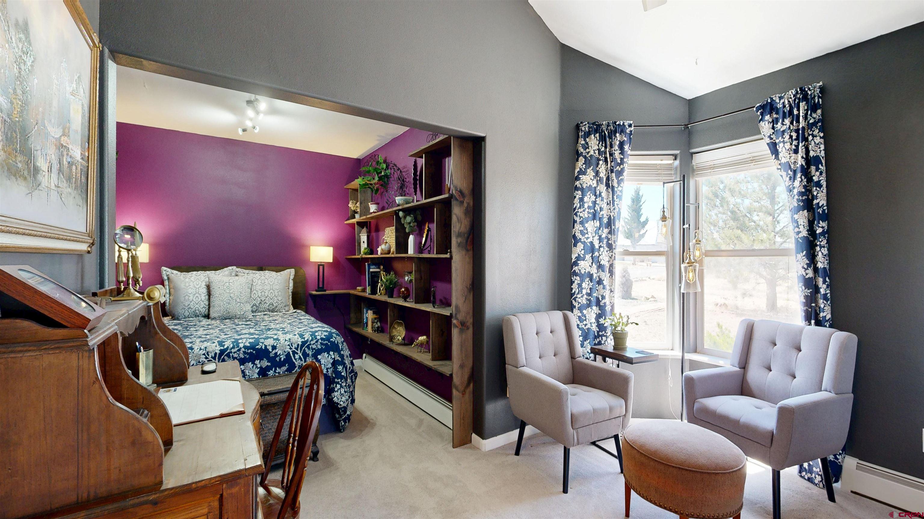 62940 Jeremy Road Montrose, CO 81401 - Photo 22 of 44 a bedroom with furniture and a large window