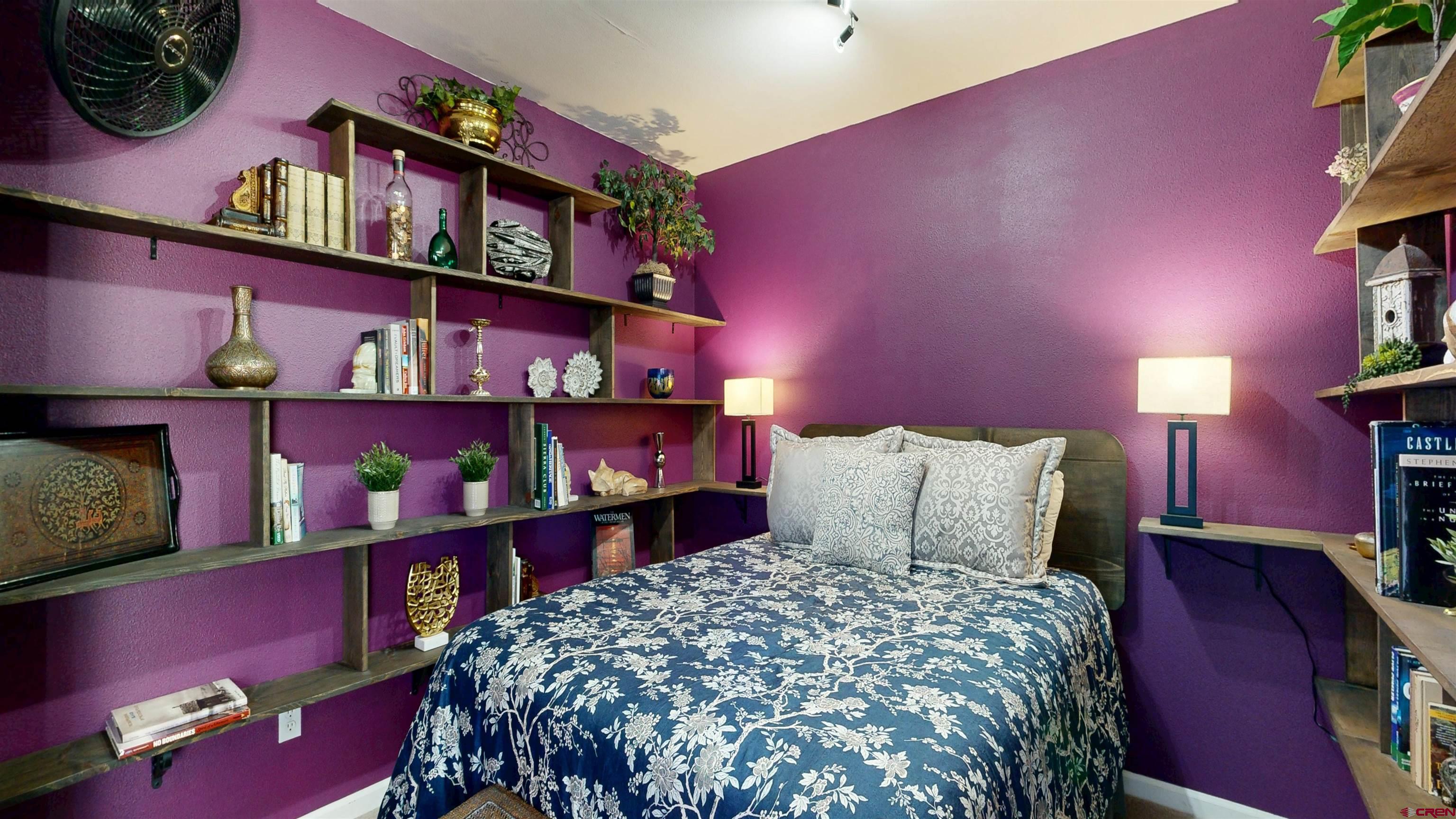 62940 Jeremy Road Montrose, CO 81401 - Photo 24 of 44 a bedroom with a bed and a closet