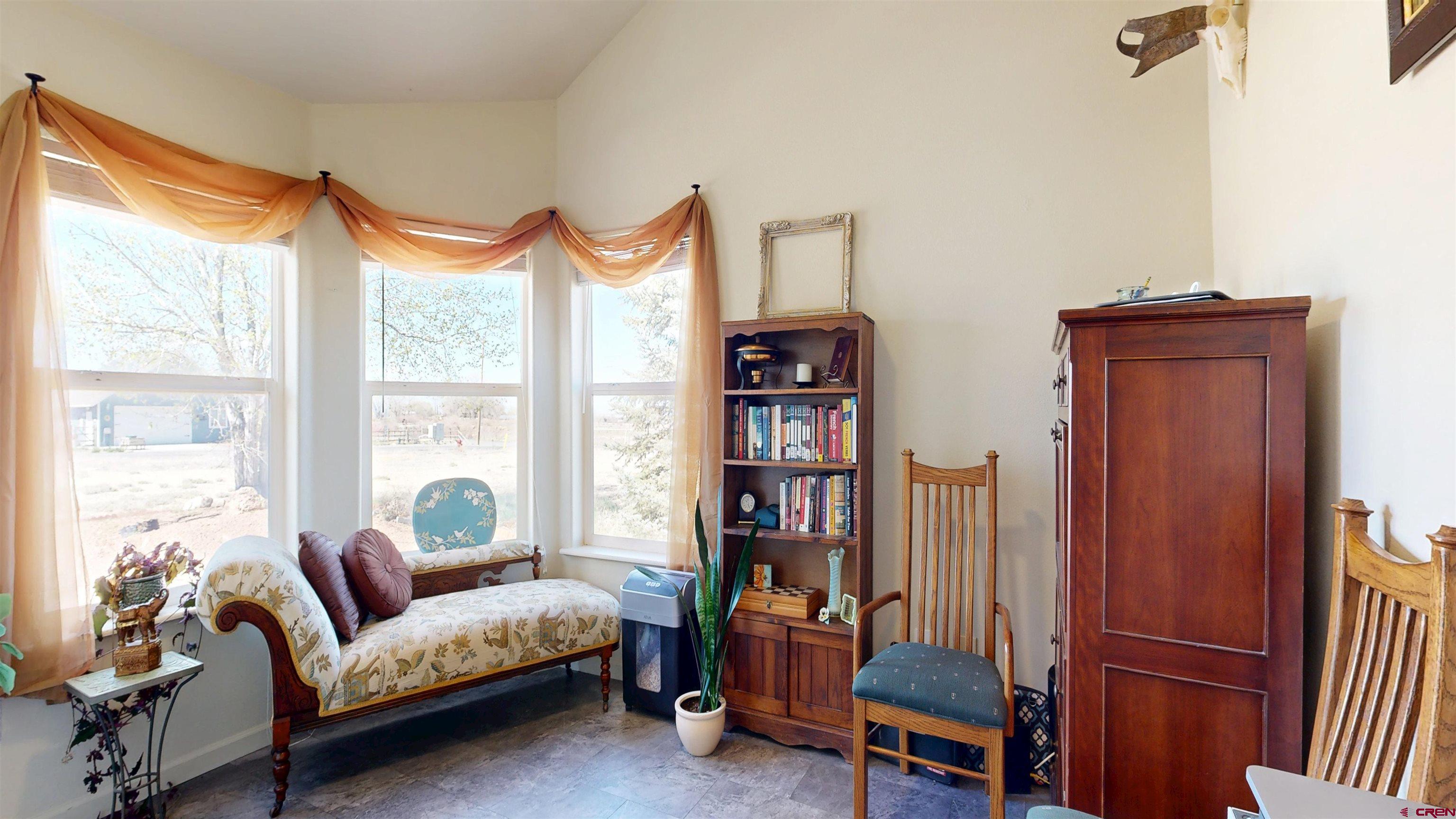 62940 Jeremy Road Montrose, CO 81401 - Photo 26 of 44 a bedroom with furniture and a window