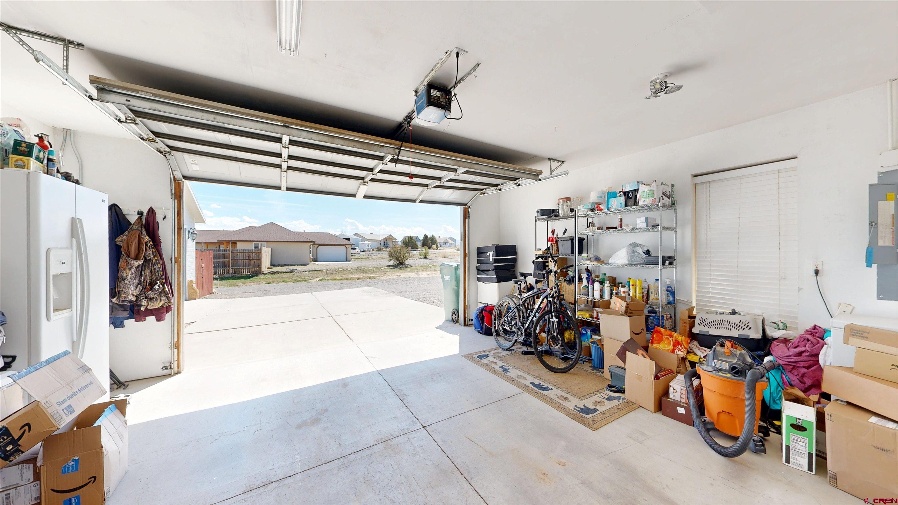 62940 Jeremy Road Montrose, CO 81401 - Photo 32 of 44 a view of a garage with rack and bicycle