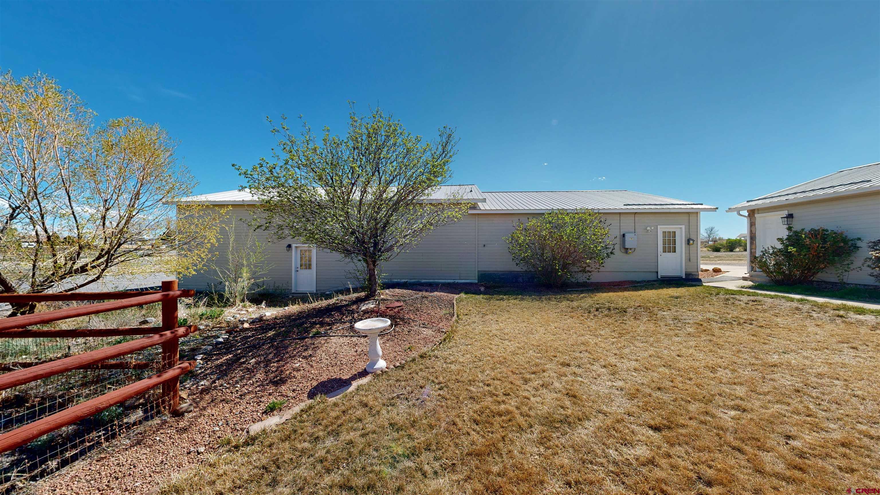 62940 Jeremy Road Montrose, CO 81401 - Photo 39 of 44 a house view with a backyard space
