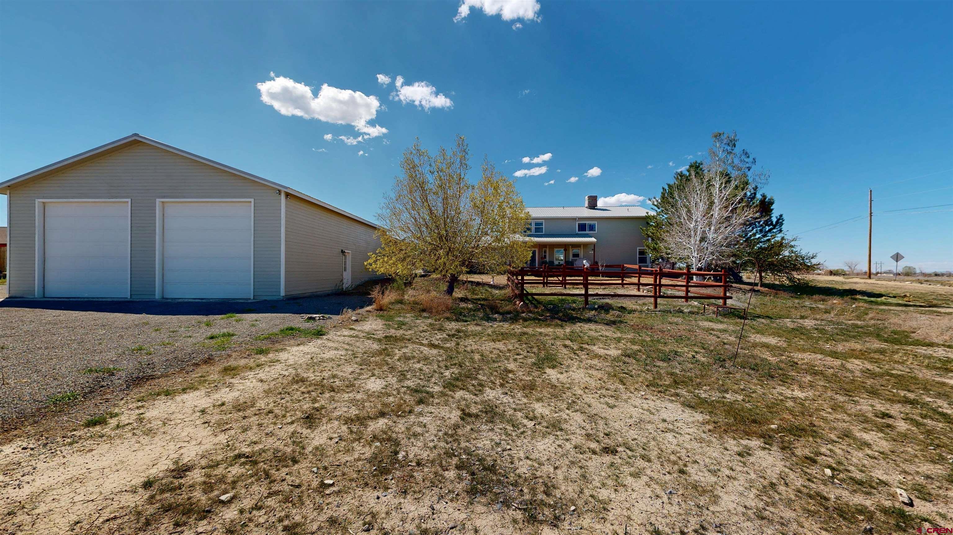 62940 Jeremy Road Montrose, CO 81401 - Photo 40 of 44 a view of a house with a yard