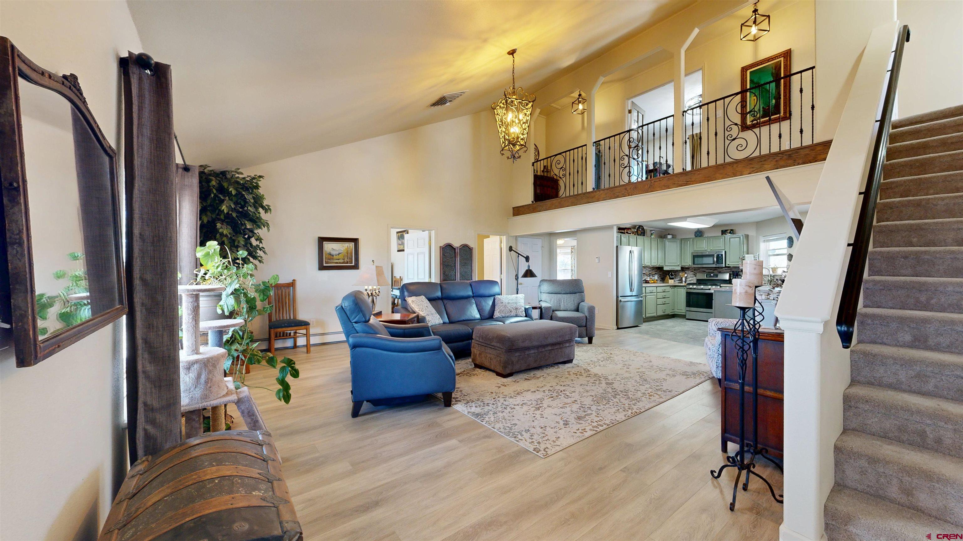 62940 Jeremy Road Montrose, CO 81401 - Photo 4 of 44 a living room with furniture fireplace and rug