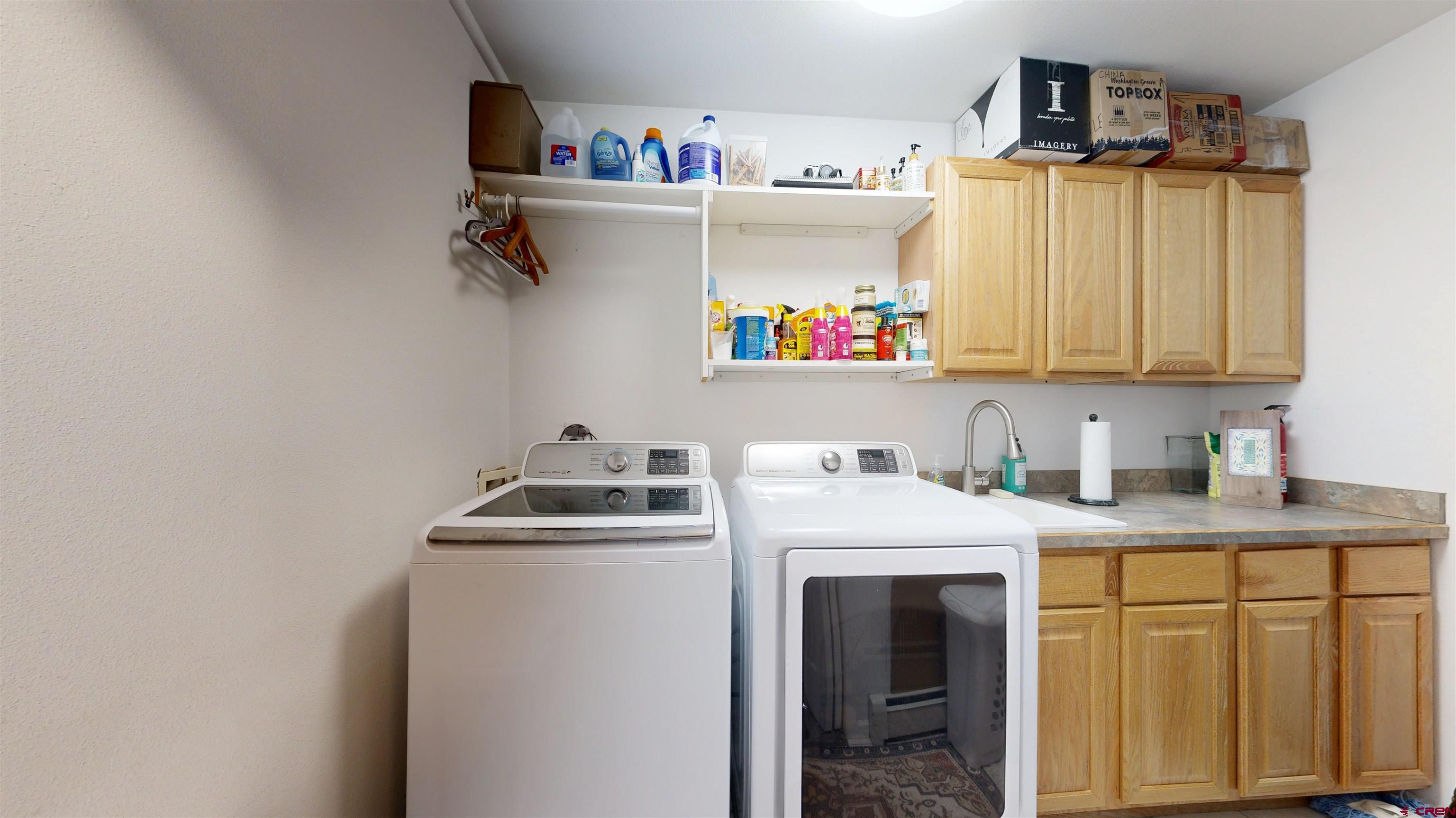 62940 Jeremy Road Montrose, CO 81401 - Photo 42 of 44 a utility room with dryer and washer