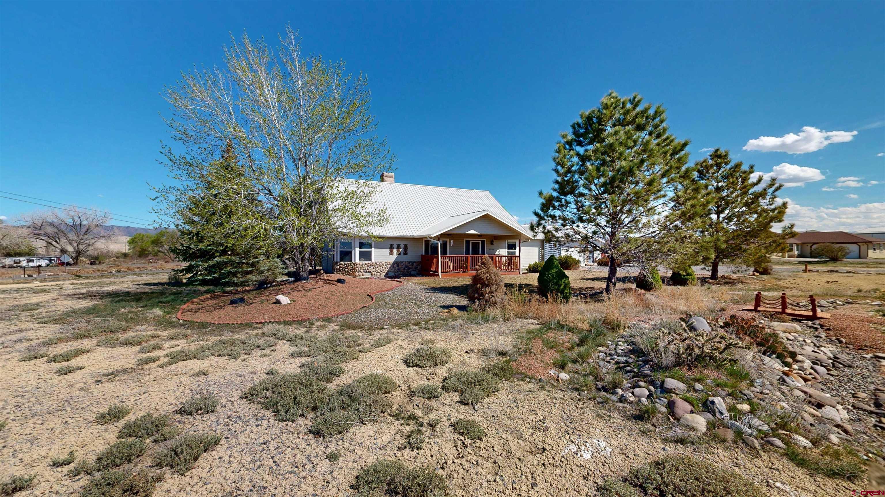 62940 Jeremy Road Montrose, CO 81401 - Photo 44 of 44 a view of a yard with plants and trees