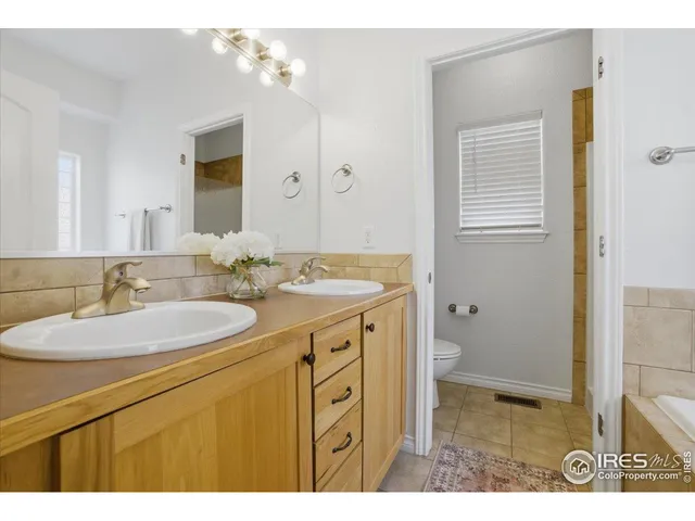 a bathroom with a sink a vanity and a mirror