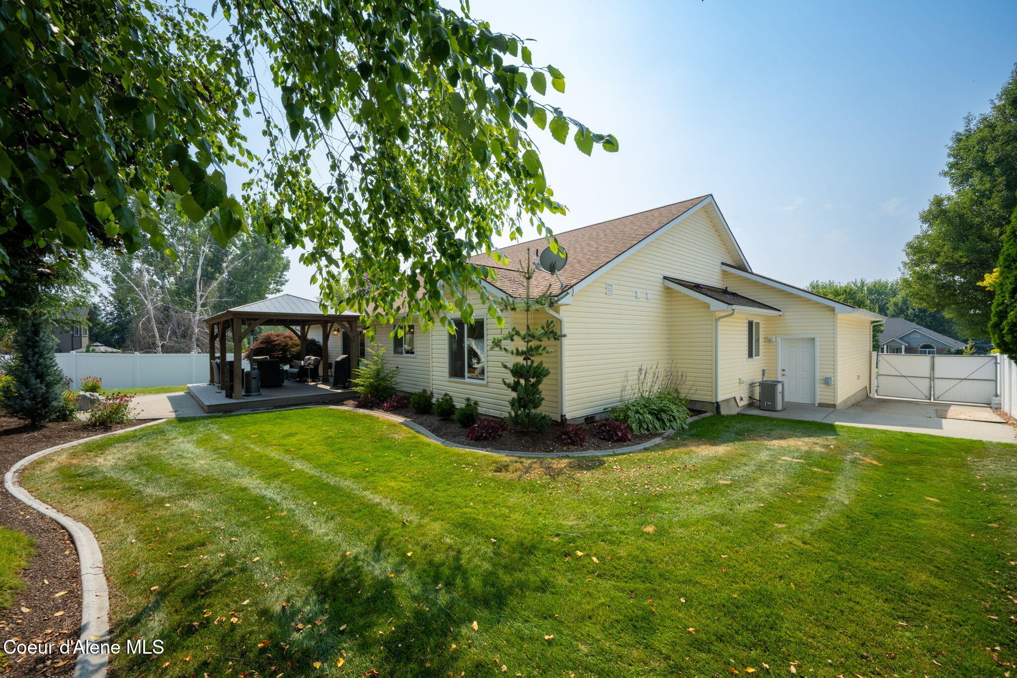 11296 North Rocking R Road Hayden, ID 83835 - Photo 27 of 29 backyard and side yard with double gate