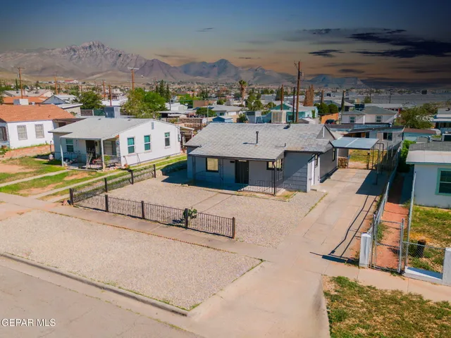 an aerial view of a house with a ocean view