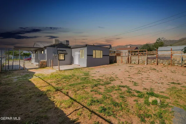 a swimming pool with outdoor seating and yard