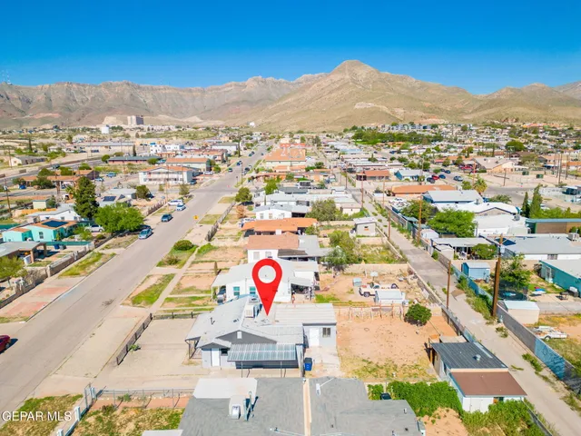 an aerial view of residential building and parking space