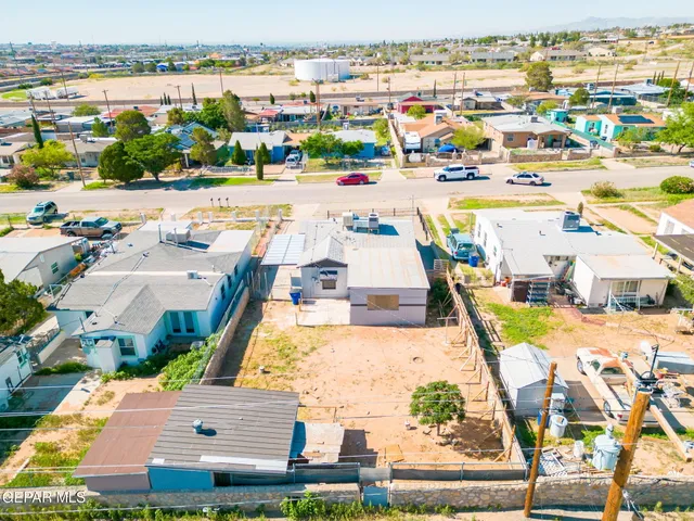 an aerial view of residential building and ocean