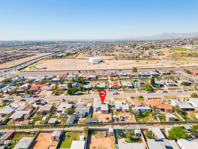 an aerial view of residential building and ocean