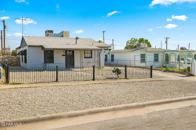 a front view of a house with a garage