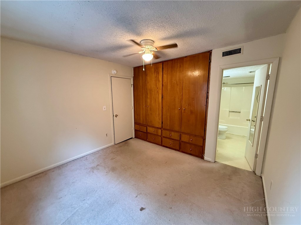 229 East King Street, Unit 30 Boone, NC 28607 - Photo 14 of 19 a view of an empty room and a ceiling fan