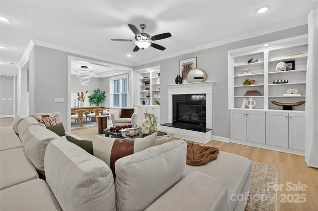 a kitchen with stainless steel appliances kitchen island granite countertop a stove a sink and a refrigerator