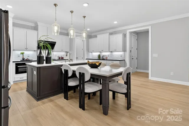 a view of livingroom with hardwood floor and a ceiling fan